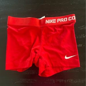 Red Nike compression shorts, small